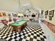 Spacious game room with a pool table and checkered floor, perfect for entertainment and leisure activities at 382 Knox Chapel Rd, Social Circle, GA 30025