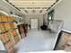 Spacious garage offering ample storage, bright lighting, and potential for various uses, creating a versatile space at 382 Knox Chapel Rd, Social Circle, GA 30025