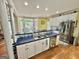 Charming kitchen with stainless steel appliances, white cabinets, and an eat-in dining area at 382 Knox Chapel Rd, Social Circle, GA 30025