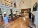 Spacious living room featuring a fireplace, vaulted ceilings, and built-in shelving at 382 Knox Chapel Rd, Social Circle, GA 30025