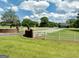 Sprawling property with a long driveway, white fencing, and a glimpse of the charming home at 382 Knox Chapel Rd, Social Circle, GA 30025