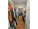 View of a well-organized walk-in closet with shelving and wooden floors, providing ample storage space at 382 Knox Chapel Rd, Social Circle, GA 30025