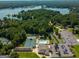 A high angle aerial view of the pool and tennis courts in a wooded residential community at 3180 Sweetbriar Dr, Villa Rica, GA 30180