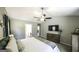 Primary bedroom features a ceiling fan, TV, and an ensuite bathroom at 3180 Sweetbriar Dr, Villa Rica, GA 30180