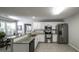 Bright kitchen featuring stainless steel appliances, granite countertops, and white cabinetry at 3180 Sweetbriar Dr, Villa Rica, GA 30180