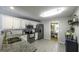 Bright kitchen featuring stainless steel appliances, granite countertops, and white cabinetry at 3180 Sweetbriar Dr, Villa Rica, GA 30180