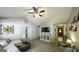Cozy living room featuring vaulted ceiling, comfortable seating, and ample natural light at 3180 Sweetbriar Dr, Villa Rica, GA 30180