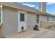 A wooden back deck offers outdoor space with door and a small window near the siding at 1341 Huey Rd, Douglasville, GA 30134