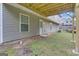 Exterior view of the home and backyard, showing the door to the basement at 1341 Huey Rd, Douglasville, GA 30134