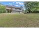 Expansive backyard featuring a well-maintained lawn and view of the home's back exterior at 1341 Huey Rd, Douglasville, GA 30134