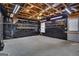 The unfinished basement area features a ceiling fan and overhead lighting at 1341 Huey Rd, Douglasville, GA 30134