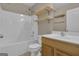 This bathroom features a shower and tub combo, vanity, and shelving at 1341 Huey Rd, Douglasville, GA 30134