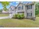 Charming two-story home with landscaped yard, showcasing its appealing architectural design at 1341 Huey Rd, Douglasville, GA 30134