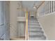 Inviting home foyer featuring a staircase with wood and white railing at 1341 Huey Rd, Douglasville, GA 30134
