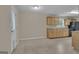 Standard kitchen featuring wood cabinets and access to a door at 1341 Huey Rd, Douglasville, GA 30134