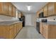Functional kitchen with laminate countertops, wooden cabinets, and essential appliances at 1341 Huey Rd, Douglasville, GA 30134