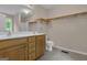 A double vanity and toilet in the main bathroom with a large mirror at 1341 Huey Rd, Douglasville, GA 30134