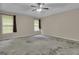 The main bedroom offers 2 windows and carpet floors, providing natural light at 1341 Huey Rd, Douglasville, GA 30134