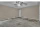This is a view of the main bedroom with a ceiling fan and ensuite access at 1341 Huey Rd, Douglasville, GA 30134