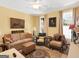 Bedroom featuring natural lighting, a ceiling fan, and multiple seating options at 1141 Pebble Creek Ln, Locust Grove, GA 30248