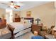 Comfortable bedroom featuring a ceiling fan, nightstands, and matching dressers offering ample storage at 1141 Pebble Creek Ln, Locust Grove, GA 30248