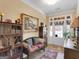 Elegant foyer with beautiful flooring, wooden furniture and a decorative painting at 1141 Pebble Creek Ln, Locust Grove, GA 30248