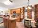 Functional kitchen featuring wood cabinetry, stainless steel appliances, and an island at 1141 Pebble Creek Ln, Locust Grove, GA 30248