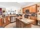 Bright kitchen with stainless steel appliances, wood cabinets, and modern finishes at 1141 Pebble Creek Ln, Locust Grove, GA 30248