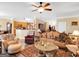 Open-concept living area with views into the kitchen and dining area, perfect for entertaining at 1141 Pebble Creek Ln, Locust Grove, GA 30248