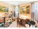 Inviting office space with a wooden desk and storage, illuminated by natural light from the windows at 1141 Pebble Creek Ln, Locust Grove, GA 30248