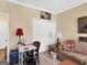 Bright and functional office featuring a sofa, desk, and storage space for a productive work environment at 1141 Pebble Creek Ln, Locust Grove, GA 30248