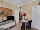 This tidy office includes a desk, closet, and TV, providing a versatile and organized workspace at 1141 Pebble Creek Ln, Locust Grove, GA 30248