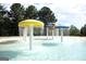 Inviting splash pad with mushroom fountains, offering a delightful water play experience for children at 1141 Pebble Creek Ln, Locust Grove, GA 30248