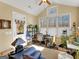 Cozy sunroom with a ceiling fan, back door access, and lots of plants at 1141 Pebble Creek Ln, Locust Grove, GA 30248