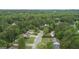 Neighborhood view showcasing the mature trees, landscaping, and serene setting at 243 Kensington Trce, Stockbridge, GA 30281