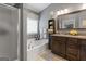 Bathroom with soaking tub, walk-in shower, and double vanity at 243 Kensington Trce, Stockbridge, GA 30281