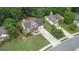 Inviting home with a well-manicured lawn, lush landscaping, and a charming front porch at 243 Kensington Trce, Stockbridge, GA 30281
