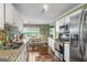 Bright kitchen with stainless steel appliances, granite countertops, and eat in kitchen at 243 Kensington Trce, Stockbridge, GA 30281