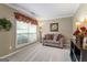 Cozy Living Room with natural lighting and designer decor at 243 Kensington Trce, Stockbridge, GA 30281