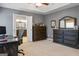 This main bedroom features two dressers and an ensuite bathroom with a double vanity at 243 Kensington Trce, Stockbridge, GA 30281