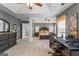 Spacious main bedroom with a tray ceiling, seating area, and adjoining office space at 243 Kensington Trce, Stockbridge, GA 30281