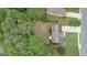 Large fenced yard with gravel firepit, mature trees offers privacy, and outdoor enjoyment at 243 Kensington Trce, Stockbridge, GA 30281