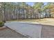 Spacious concrete back patio overlooking the yard, perfect for outdoor gatherings and entertainment at 1234 Coweta Heard Rd, Hogansville, GA 30230