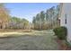 Expansive backyard with lush greenery and a serene wooded backdrop at 1234 Coweta Heard Rd, Hogansville, GA 30230
