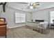 Bedroom with neutral walls, ceiling fan, carpet flooring, and a large window for natural light at 1234 Coweta Heard Rd, Hogansville, GA 30230