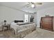 Spacious bedroom featuring neutral carpet, a ceiling fan, and ample space for storage at 1234 Coweta Heard Rd, Hogansville, GA 30230
