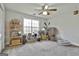 Bright bedroom with natural light, ceiling fan, and charming bohemian decor at 1234 Coweta Heard Rd, Hogansville, GA 30230