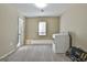 Neutral bedroom with carpet flooring, natural light from one window, and utility hookups at 1234 Coweta Heard Rd, Hogansville, GA 30230