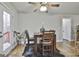 Cozy dining area with a wooden table, chairs, and natural light, perfect for gatherings at 1234 Coweta Heard Rd, Hogansville, GA 30230