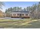 Charming single-story home with inviting front porch, white siding, and a lush green lawn at 1234 Coweta Heard Rd, Hogansville, GA 30230